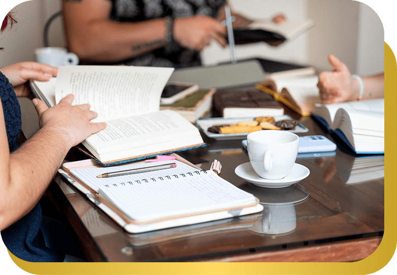 People reading books with coffee and snacks