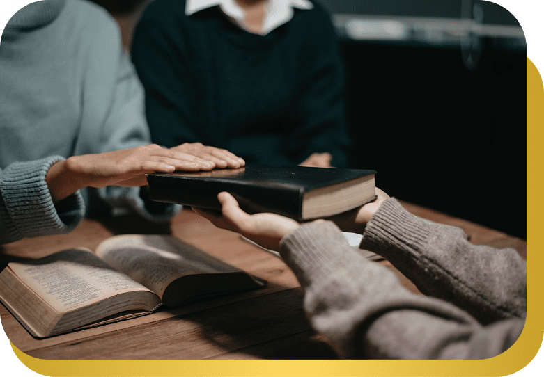 People holding book, taking an oath