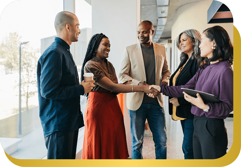 Colleagues greeting each other warmly