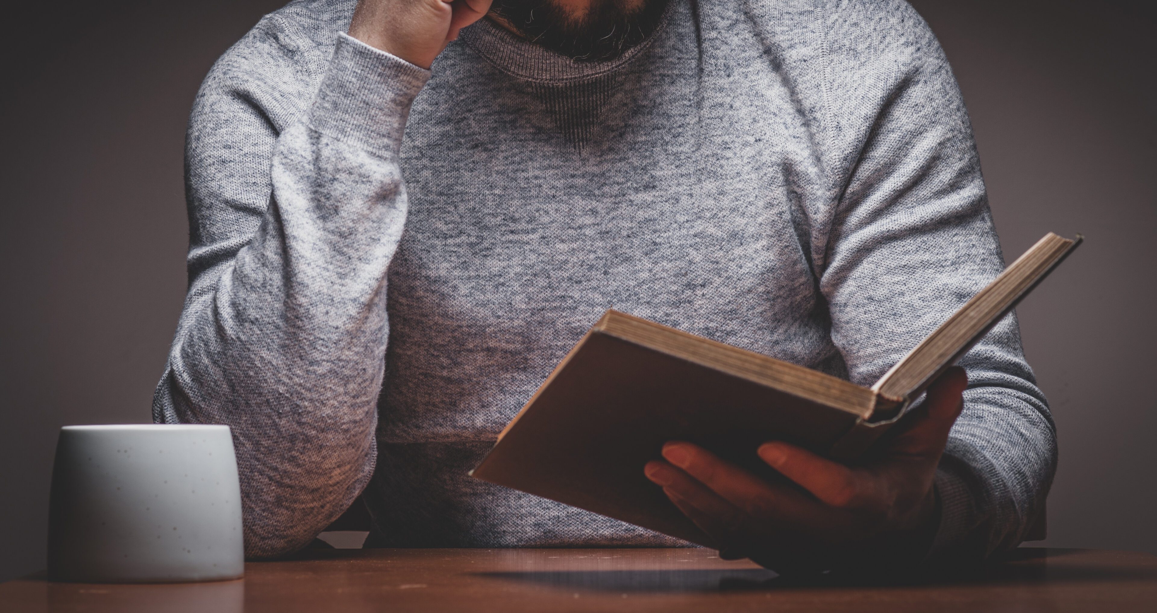 Man is Looking or Reading on Old Books